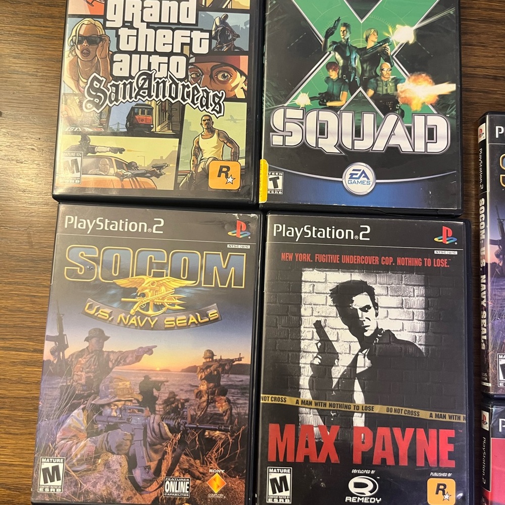 Sony PlayStation 2 Game Set - Black and Multicolor Cases